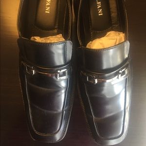 Men’s black dress shoes.